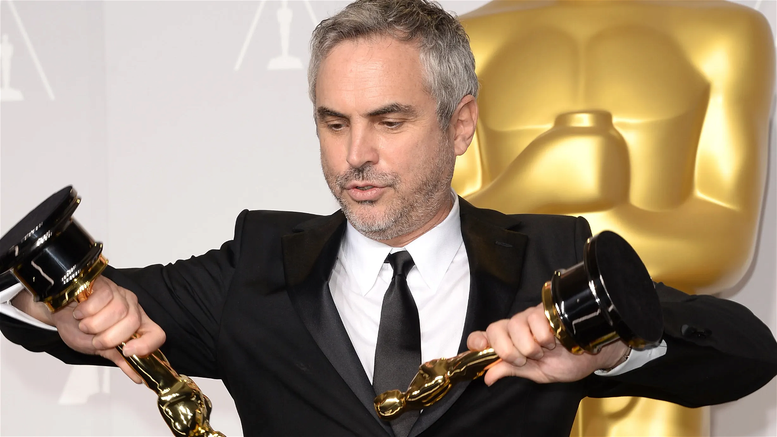 Director Alfonso Cuarón winning Oscar for Gravity