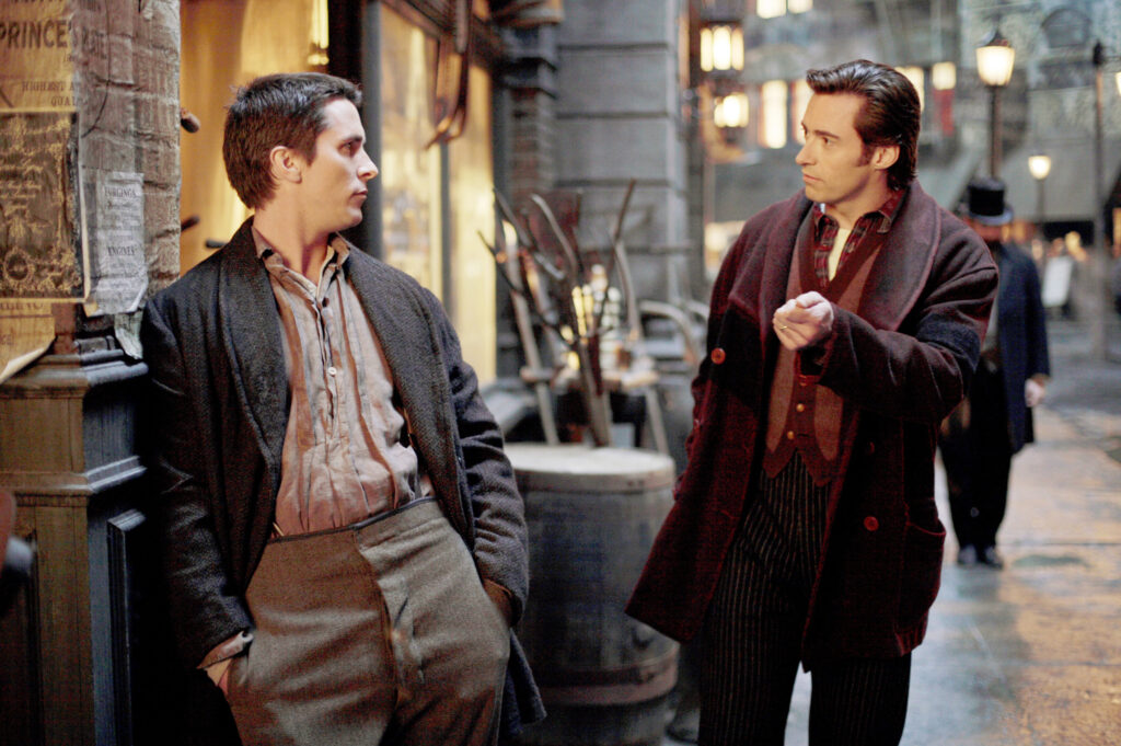 Christian Bale as Alfred Borden and Hugh Jackman as Robert Angier in Christopher Nolan's The Prestige