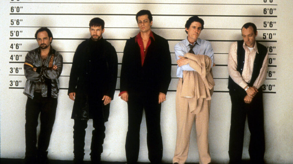 Kevin Pollak, Stephen Baldwin, Benicio Del Toro, Gabriel Byrne and Kevin Spacey line up in a scene from The Usual Suspects