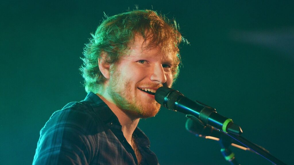 Ed Sheeran performing at a concert