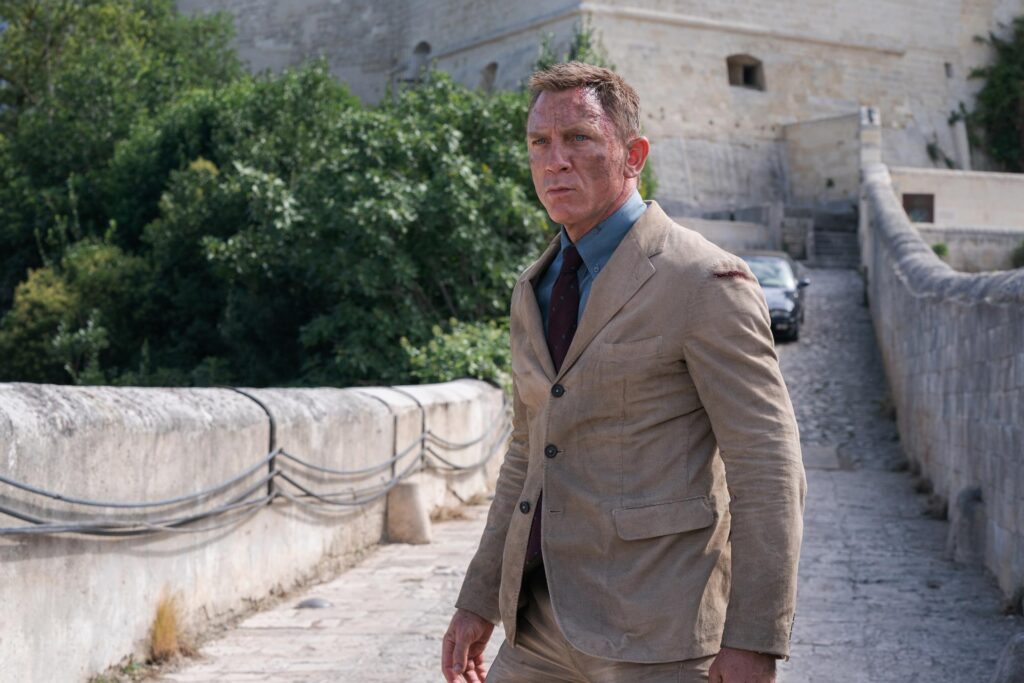 A bruised Daniel Craig as James Bond in No Time to Die