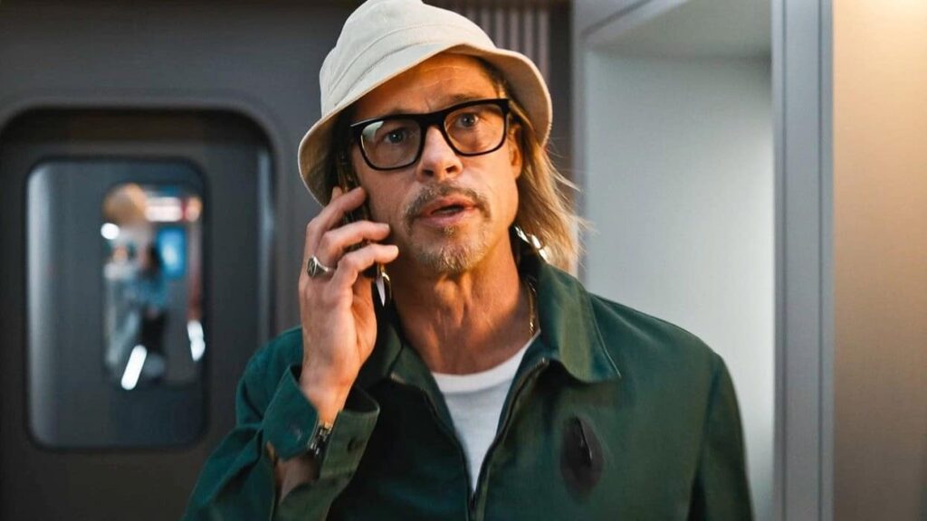 Brad Pitt talking on the phone in a still from Bullet Train