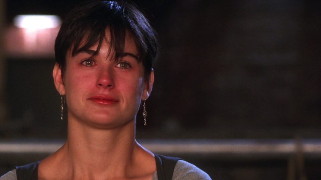 A crying Demi Moore in a still from Ghost 