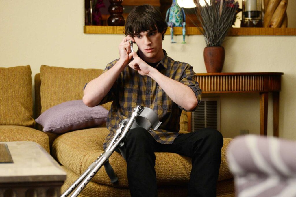 RJ Mitte as Walter White Jr. dialing a phone in Breaking Bad | Credits: AMC