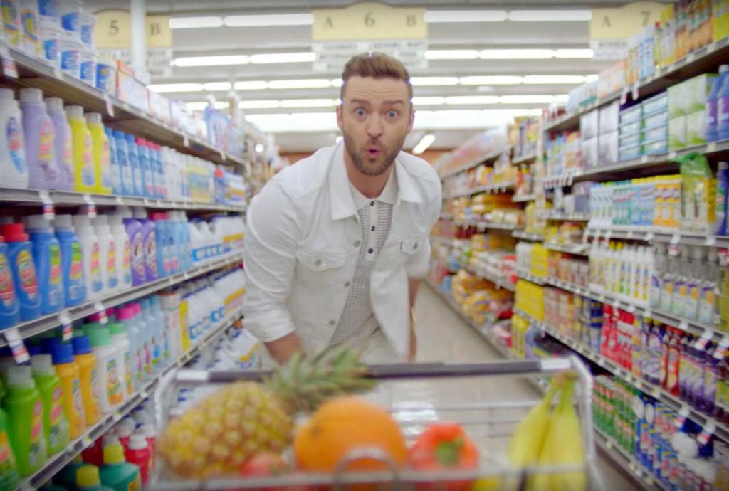 Justin Timberlake in a shopping mall in ax still from Can't Stop The Feeling! music video