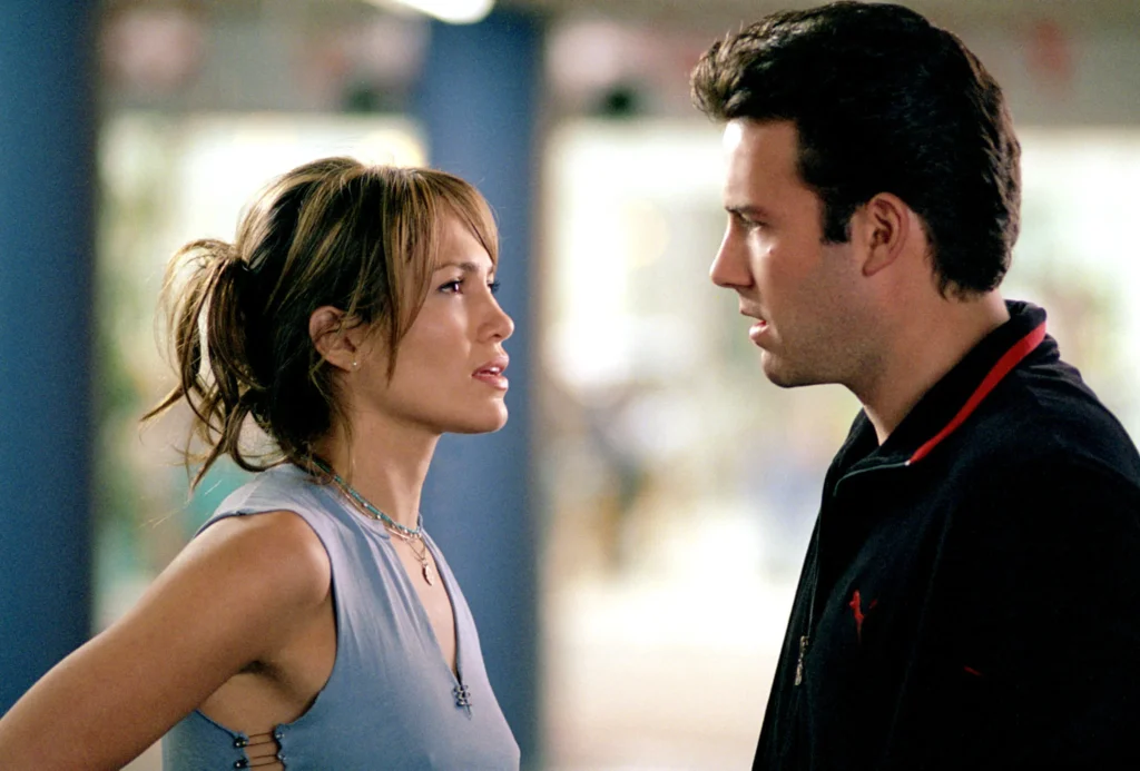 Jennifer Lopez and Ben Affleck looking at each other in a still from Gigli