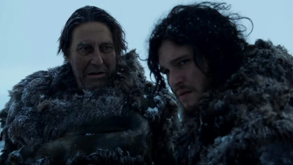 A still of Ciarán Hinds as Mance Rayder alongside Kit Harington in Jon Snow in Game of Thrones