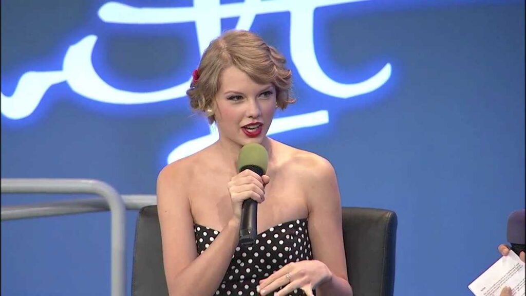 Taylor Swift speaking during a media appearance,