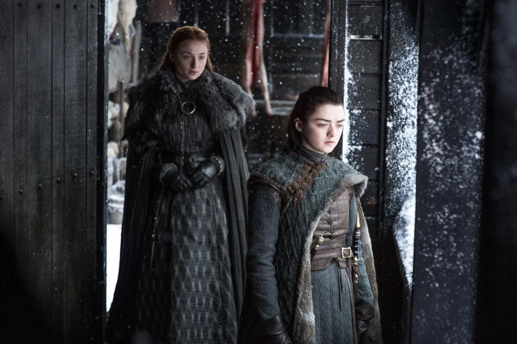 Sophie Turner as Sansa Stark and Maisie Williams as Arya Stark