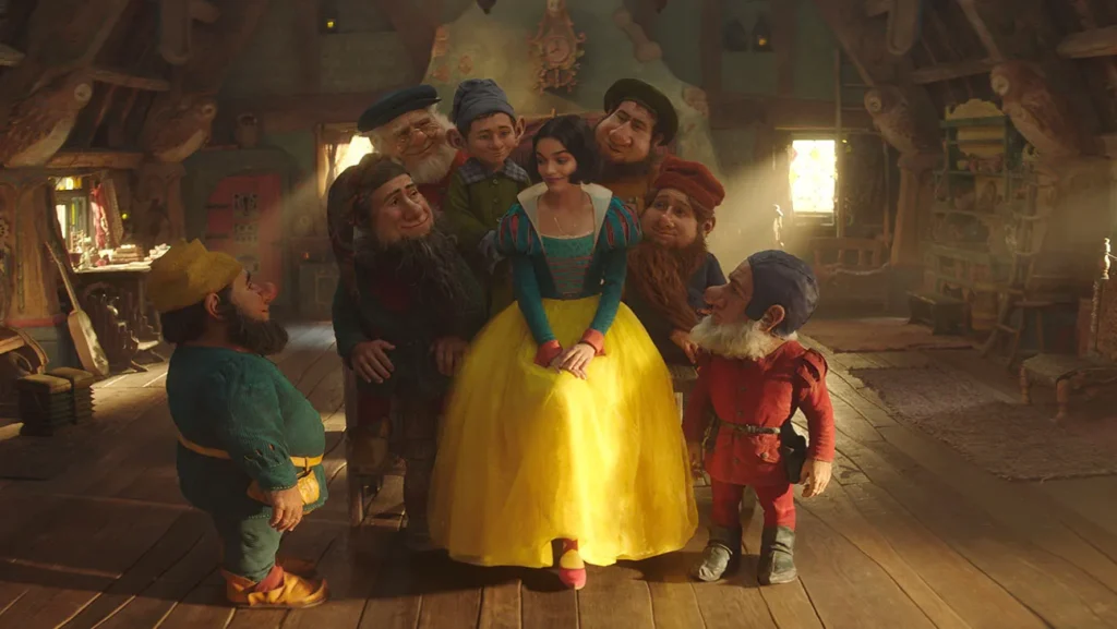 Rachel Zegler as Snow White alongside the seven dwarfs in the upcoming live-action adaptation