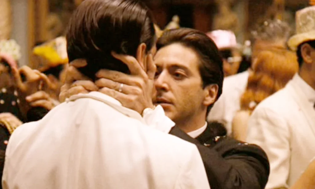 Al Pacino's Michael Corleone holding John Cazale's Fredo Corleone in The Godfather Part II's New Year's Eve scene