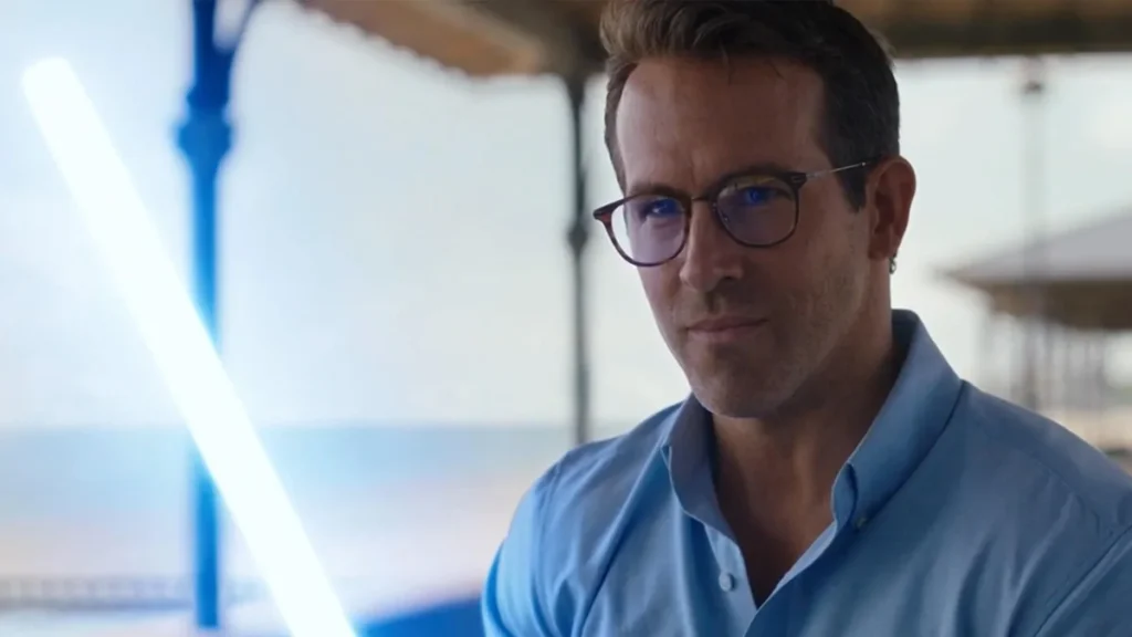 Ryan Reynolds with a lightsaber in Free Guy