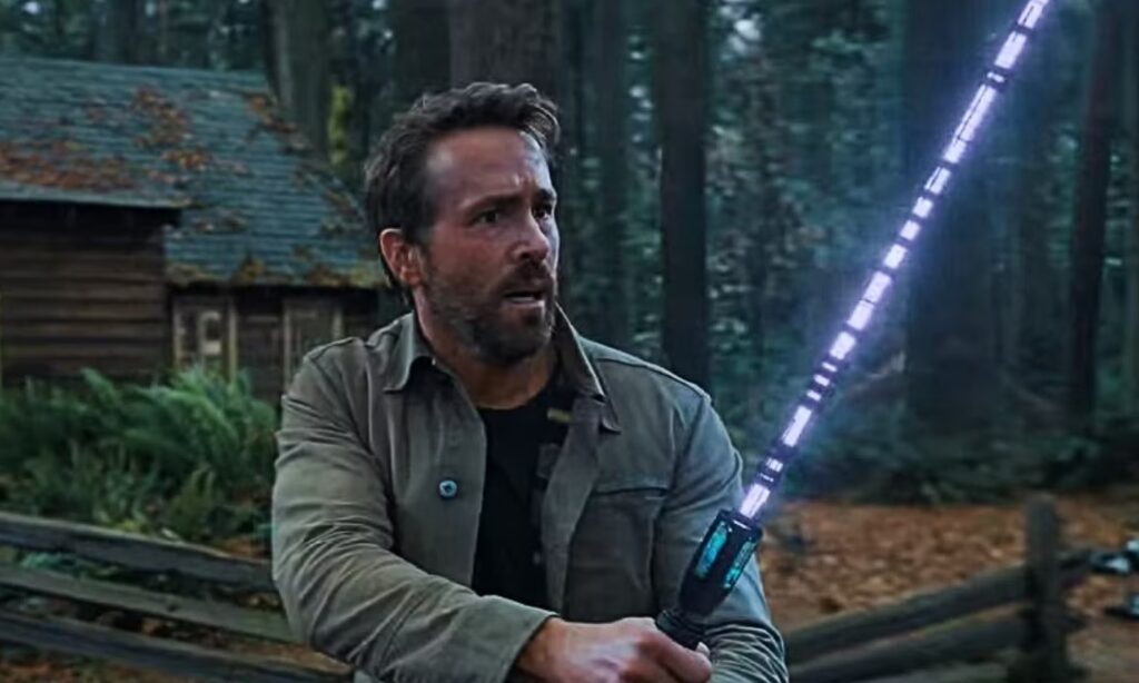 Ryan Reynolds with a lightsaber in The Adam Project