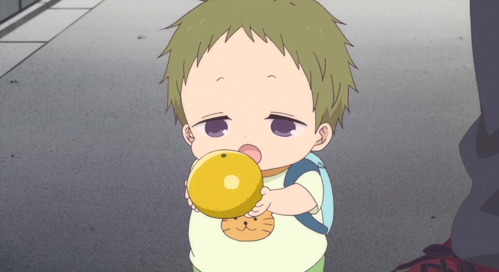 Kotarou holding a orange