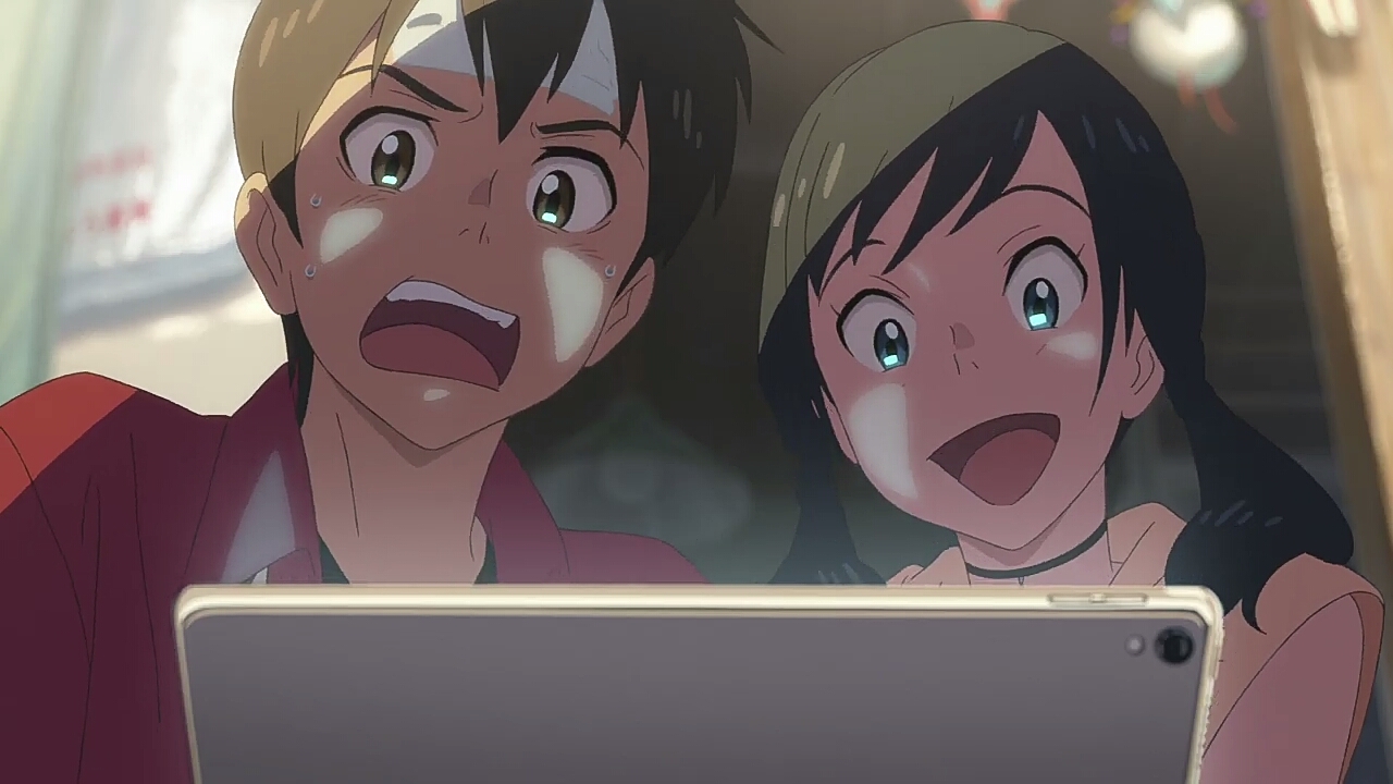 Hodaka and Hina looking at laptop
