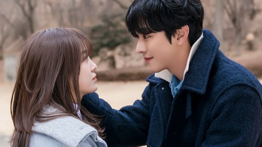 A still from business proposal with two characters looking at each other