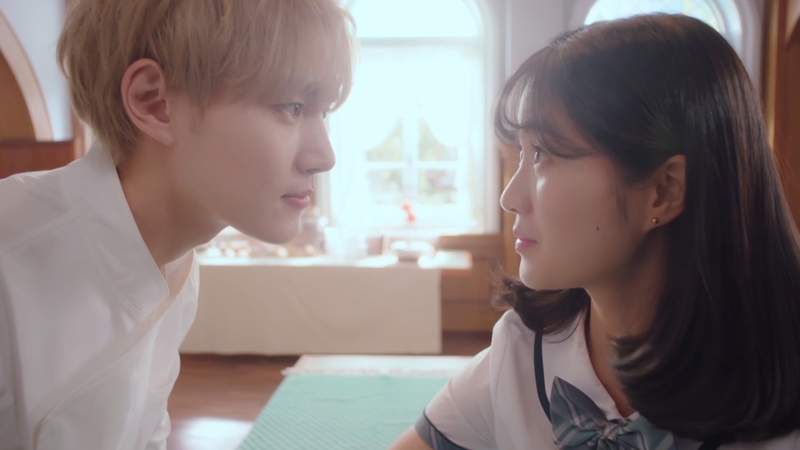 A still from extraordinary you with the characters looking deeply into each others' eyes