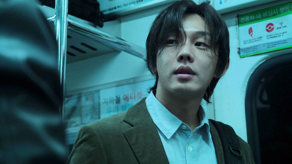A still from hellbound with a character in train