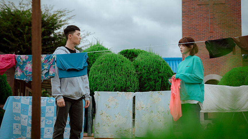 A still from Itaewon class with characters doing laundry